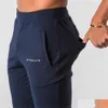 Herrenhosenstil Alphalete Marke Jogger Jogginghose Man Fitnessstudios Workout Fitness Baumwollhosen Männliche lässige Mode Spur Deli OTR5N