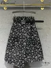 Kjolar fashionabla a-line svart kjol 2024 vår och sommar blommig hög midja bantning casual kvinnors knälängd