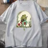 かわいいコテージのTシャツ美学のカエルマッシュルームTシャツでバンジョーを演奏