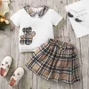 T-shirts Girls 1-6 år gammal vår- och sommarkoreansk version av Burst Cute Bear Print Short Sleeve Top Plaid kjol Princess Suitl2404