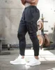 سراويل الرجال الرجال sweatpant سراويل متعددة الجيب السراويل في الكاحل السوستة للرجال الركض غير الرسمي الخريف رجال أسنانات السراويل D240425