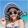 Chapéus de balde largos Chapéus de balde vendendo moda de moda hepburn estilo preto e branco listrado arco de verão chapéu de sol lindo str praia chapéu grande chapéu cônico j240425