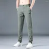 Calças masculinas Primavera Summer Homens casuais finos trechos magros e elásticos da cintura elástica clássica calça coreana masculina verde cinza