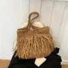 Drawstring Bohemian Tassel Hollow Tote Bag Designer Straw Woven Women Handväskor Sommarstrandsäckar Casual Bali axel