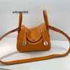 Femme sac à main L Linndies 2024 Nouveau mini mini Togo Pilandy Band Band Cow Hide Doctor Sac Fashion Womens One épaule Bag du corps