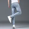 Luxe zomerontwerper Koreaanse klassieke streetwear cowboybroek voor mannen modieuze en comfortabele vriendje skinny jeans 240417