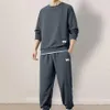 Casual Sports Suit Mens Sport avec Waffle Texture Sweat-shirt Pantalon Jogger Set pour les hommes de style jeunesse d'hiver d'hiver 240411