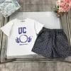 Nieuwe baby tracksuits Summer Boys Set Kids Designer Design Kleding Maat 100-150 cm T-shirt en volledige afdruk van cirkelvormige logo shorts 24APRIL