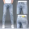 Luxe zomerontwerper Koreaanse klassieke streetwear cowboybroek voor mannen modieuze en comfortabele vriendje skinny jeans 240417