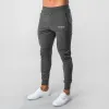 Calça de moletom 2023 nova fitness muscular que executa o treinamento esportivo de algodão calças de algodão masculino de feixe de feixe fino calças de saúde casuais