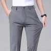 Pantalon masculin printemps d'été pantalon décontracté business slim fit slim élastique jogger jogger coréen classique mince pantalon gris noir mâle d240425