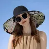 Cappelli larghi cappelli da secchio cappelli da donna estate a doppio lato brim brim -brim -solare per la spiaggia floreale beach hat womens outdoor elegante cappello solare cappello all'ingrosso nuovo 240424