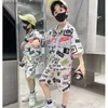 Set di abbigliamento set da ragazzo estivo set per bambini in modo a manica corta single a manica corta top e pantaloncini in basso 2 pezzi abiti da spiaggia Q240425