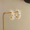 Boucles d'oreilles de fleur de perle en forme de coque en C