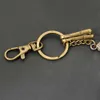 Клавные ланирды Wannee Fashion Mini Retro Bronze Metal Car Key Chain Multi -камеры струны стильные брелоки для мужчин подвеска для творчества творческий подарок украшения