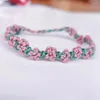 Bracelet de tissage de fleur de pêche à la pêche à la corde à la main de charme de fleur de printemps ajusté à la main