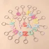 Keychains lanyards modehars 26 letters a-z alfabet sleutelhangers voor autosouvenir geschenken voor vrouwelijke mannen handtas hangers sleutels diy accessoire