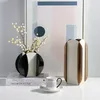 Vasen moderne einfache Metall Leder Blumenkunst Dekoration Wohnzimmer Model Couchtisch Haus Licht Luxus Veranda