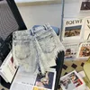 Kvinnors shorts koreanska sommaren hög midja singelbröst a-line jeans shorts tofs raw kant denim shorts för kvinnor y240425