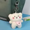 Sac à dos mignon et idiot, pendentif poupée en peluche en peluche, poupée en peluche de dessins animés, porte-clés, sac à main, cadeau en gros cadeau de pendentif