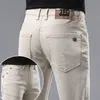 Estilo jeans cáqui europeu para a primavera e verão masculino slim fit small tras reto elástico casual calças de algodão puro comprido