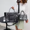 Kvinnors lyxväska 90% Factory Hot Sales Partihandel Single Shoulder Crossbody Handväska Ny transparent gelé Tygväska mode mångsidiga handhållna shoppingstrandväskor