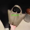 Picotin en cuir bacs en gros du nouveau sac pour femmes togo petit panier de légumes de vache sac à eau sac européen et grande marque Litchi a le logo hb25vs