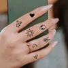 Transfert de tatouage étanche à tatouage temporaire étalant Roman Numerals Leaf Alien Star Moon Sun Flash Tatoo Faux Tatto Finger pour hommes Femmes Girl 240427