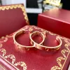 Brincos de designer Brincos de manguito anel Jóias de jóias de designer Brincos de diamante dourado Brincos de aço inoxidável Brincos dourados feminino Feminino