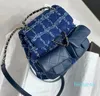 2024 Новая мода Duma Designer Woolen Double Pocket Simbag Advanced Женская Кембриджская сумка мини -рюкзак