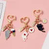 Keychains Lanyards Cute Love Heart Kitten Keychain Cartoon Black White Cat Key Ring for Girls Bag Car Ornaments Earphone Case Pendant Couple Gifts