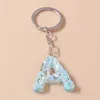 Keychains lanyards modehars 26 letters a-z alfabet sleutelhangers voor autosouvenir geschenken voor vrouwelijke mannen handtas hangers sleutels diy accessoire