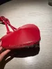 Высоко качества 2024 Новая красная кожаная в форме сердца сумка для плеча универсальная модная персиковая сумка для сердца кросс -кубика Перекрестная сумка