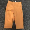 Pantaloni attivi di colore solido di buona qualità di alta qualità con leggings da yoga laterale Pocket Fitness Women Sports Pant Pant Fallo di allenamento completo Compressio