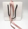 Bolsa de joyería de papel blanco de cinta rosa Caja de cartón para pulseras europeas Pendientes anillo Collar Embalaje de joyas y exhibición3608177