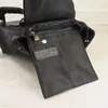 Rucksack hochwertiger Metallschnalle Black Nylon Crossbody Bag Fashion Mini -Kordel für Mann und Frauen