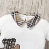 T-shirts Girls 1-6 år gammal vår- och sommarkoreansk version av Burst Cute Bear Print Short Sleeve Top Plaid kjol Princess Suitl2404