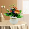 Flores decorativas de planta realista em vasos de plantas elegantes