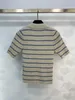 T-shirt pour femmes Début de printemps Nouveau Pra Nanyou Gaoding Fresh Academy Style Bouton Polo Collier Contrast Stripe Stripe Short Sleeve Tricoted Top U469