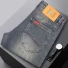 Ende hohe Jeans Herbst und Winter dicke angemessene Straße Stickerei Elastic Smoke Grey Modemarke Vielseitige Jugendhose für Männer