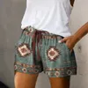 Kvinnors shorts trend kvinnliga shorts elastiska midjeband svett absorption sak retro tryck utdragande lösa shorts y240425