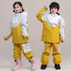 Vestes de ski 2024 enfants Suis-en-ski garçons garçons chauds en plein air veste de snowboard enfants ensemble pantalon de neige d'hiver imperméable du vent.