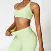 Women's Tracksuits New yoga set 2PCS womens track and field seamless sportswear gym clothing drawstring high waist leg fitness sportswear 240424