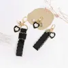 Keychains Lonyards rétro noir amour keychain mode basse arc pendentif pour femmes pour femmes chèques de clés de clés