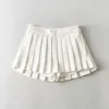 Kjolar dptown sommar sexiga minikjolar med korta kvinnors höga midje kjolar vintage veckade kjol koreanska tennis kjolar vita svart y240420