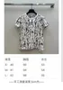 Kvinnors t-shirtdesigner Nanyou Zhi 2024 Vår/sommar ny klassisk rund hals tryckt t-shirt elegant och smal passform mångsidig kort topp u8bg