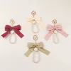 Keychains Lonyards Imitation Pearl Kelechain Sweet Fashion Ribbon Bowknot Accessoires de clés en métal Boucle de boucle