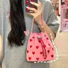 Drawstring niche geborduurde liefde handheld canvas tas 2024 lente en zomer one-shoulder cross-body mini-emmer wandelen