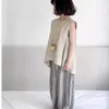Set di abbigliamento ragazze set estate 2024 giubbotto coreano camicia senza maniche e sottili pantaloni gamba larga a strisce per bambini abiti