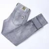 Jeans de créateurs pour hommes jeans européens jeans élastique élastique slim slim small pieds droits mode pantalon gris pour hommes lavés à la mode